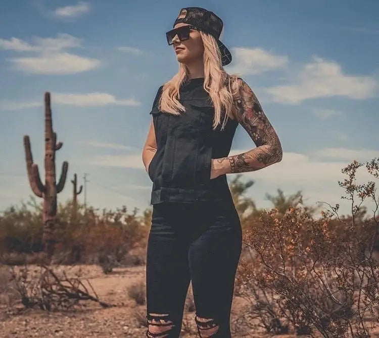 Woman in black outfit wearing women’s motorcycle vests from the Women’s Vests collection