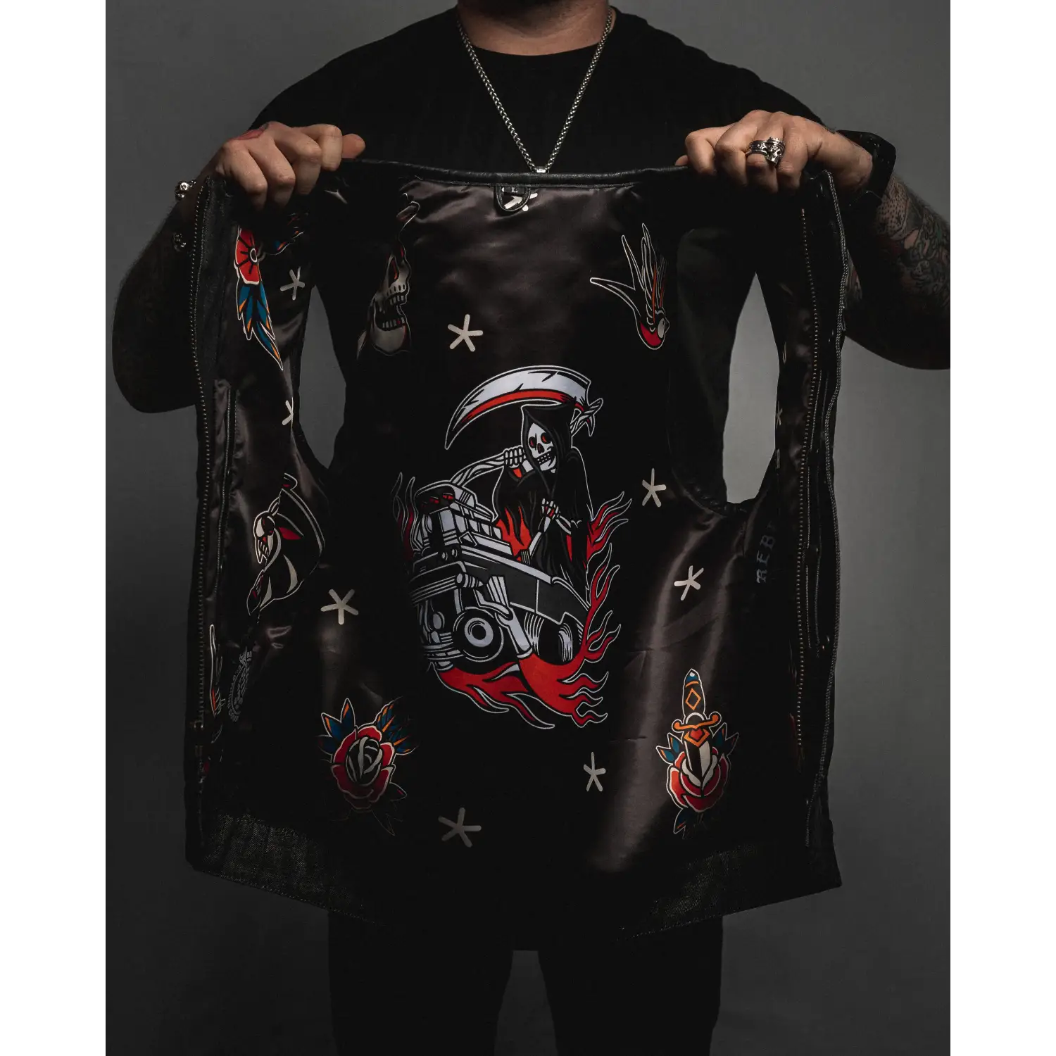 Black leather vest with grim reaper and dagger designs featuring concealed carry pockets and double diamond stitching